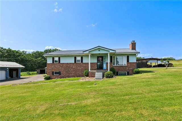 379 Airport Rd, Worthington, PA 16262 - ranch-style house with a chimney, brick siding, and a front yard