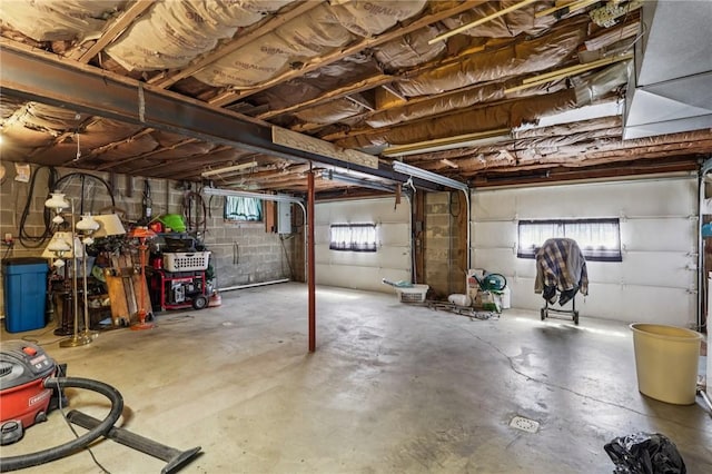 379 Airport Rd, Worthington, PA 16262 - below grade area featuring concrete block wall, a garage, and plenty of natural light
