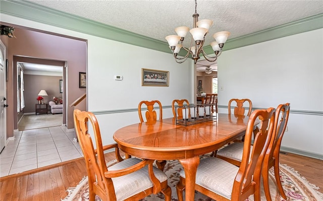 3150 Sundance Ct, Hampton, PA 15101 - dining area featuring a chandelier, light wood-style floors, and a textured ceiling