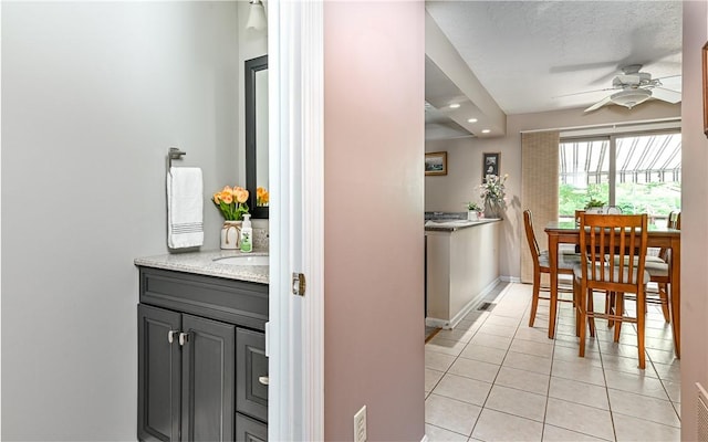 3150 Sundance Ct, Hampton, PA 15101 - kitchen featuring ceiling fan, light tile patterned floors, recessed lighting, and light stone counters