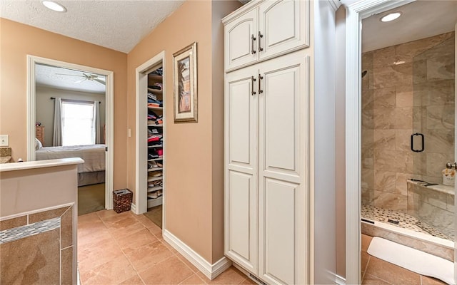 3150 Sundance Ct, Hampton, PA 15101 - ensuite bathroom featuring a shower stall, ceiling fan, a textured ceiling, recessed lighting, and a spacious closet