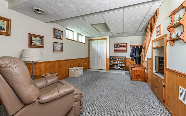 3150 Sundance Ct, Hampton, PA 15101 - living area with wainscoting, wood walls, and carpet floors
