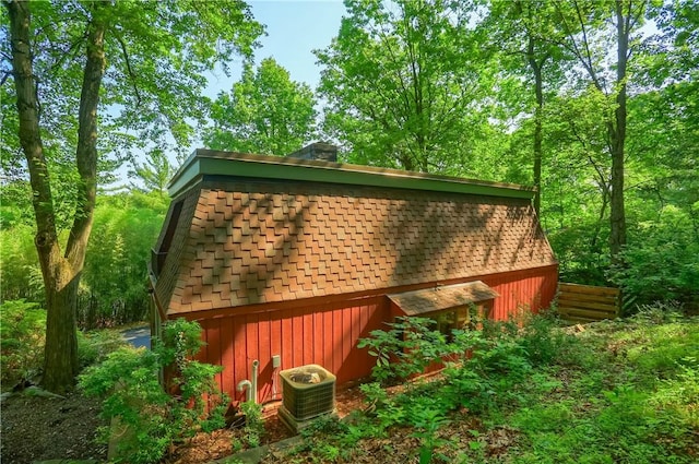 113 S Heide Ln, Peters Twp, PA 15317 - view of property exterior featuring a shingled roof and a central AC unit