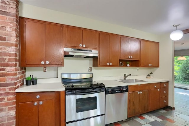 113 S Heide Ln, Peters Twp, PA 15317 - kitchen featuring appliances with stainless steel finishes, under cabinet range hood, light countertops, and brown cabinetry