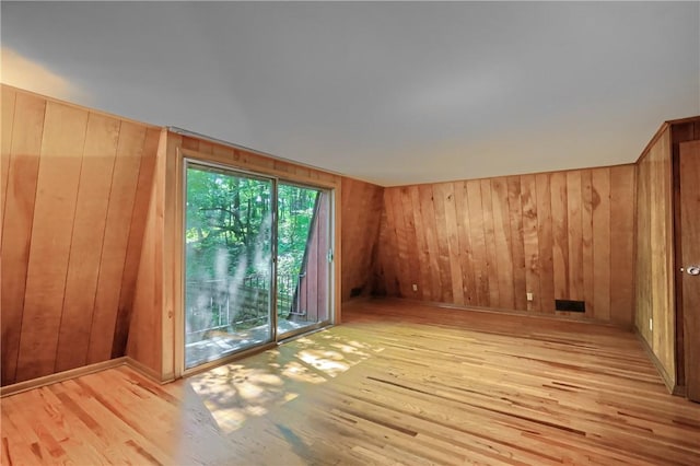 113 S Heide Ln, Peters Twp, PA 15317 - unfurnished room with light wood-style flooring and wooden walls