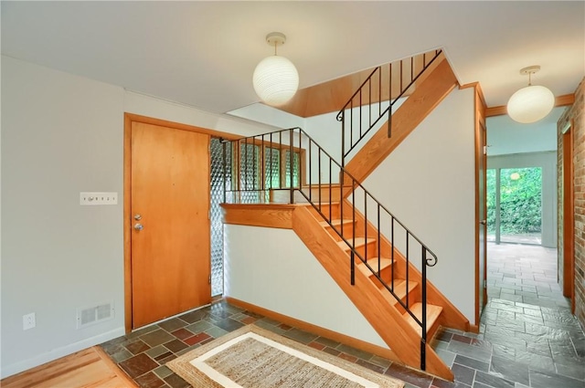 113 S Heide Ln, Peters Twp, PA 15317 - entryway with stone tile floors and stairs