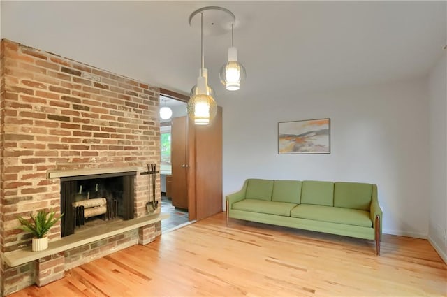 113 S Heide Ln, Peters Twp, PA 15317 - living room featuring wood finished floors and a brick fireplace