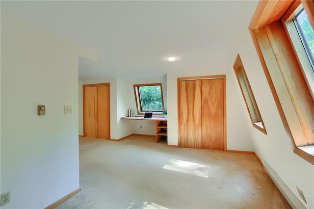 113 S Heide Ln, Peters Twp, PA 15317 - unfurnished bedroom with multiple windows, two closets, carpet flooring, and built in desk
