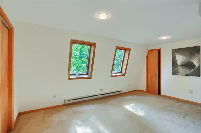 113 S Heide Ln, Peters Twp, PA 15317 - unfurnished bedroom with baseboard heating, light carpet, and a closet