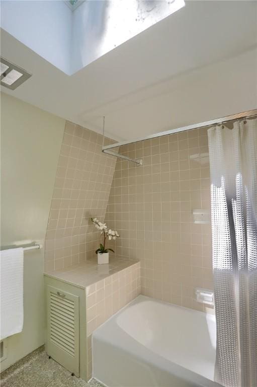 113 S Heide Ln, Peters Twp, PA 15317 - bathroom featuring shower / tub combo and tile walls