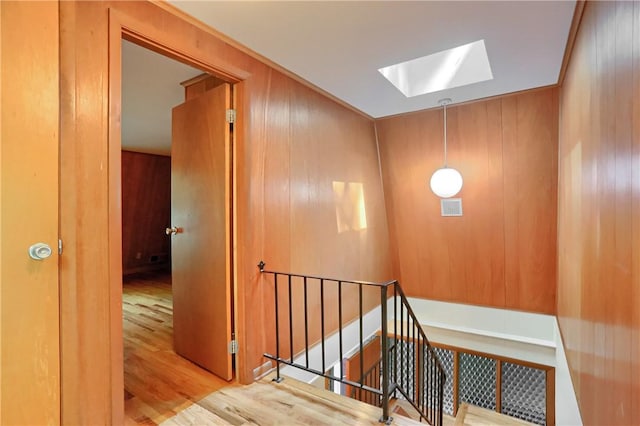 113 S Heide Ln, Peters Twp, PA 15317 - staircase with a skylight, wood finished floors, and wood walls