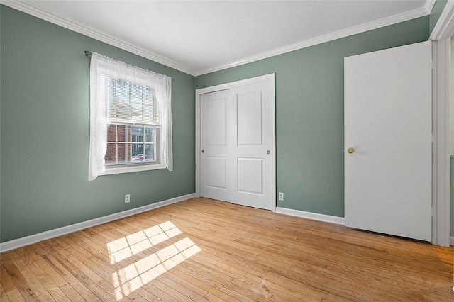 158 Jamestown Ct, Pittsburgh, PA 15216 - unfurnished bedroom featuring crown molding, light wood-style flooring, and a closet