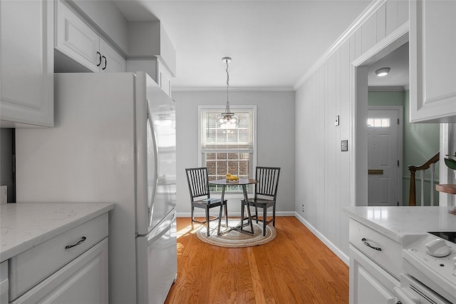158 Jamestown Ct, Pittsburgh, PA 15216 - kitchen with freestanding refrigerator, ornamental molding, plenty of natural light, light wood-style flooring, and white cabinetry
