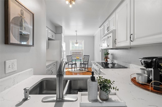 158 Jamestown Ct, Pittsburgh, PA 15216 - kitchen with white appliances, white cabinets, hanging light fixtures, light stone countertops, and crown molding