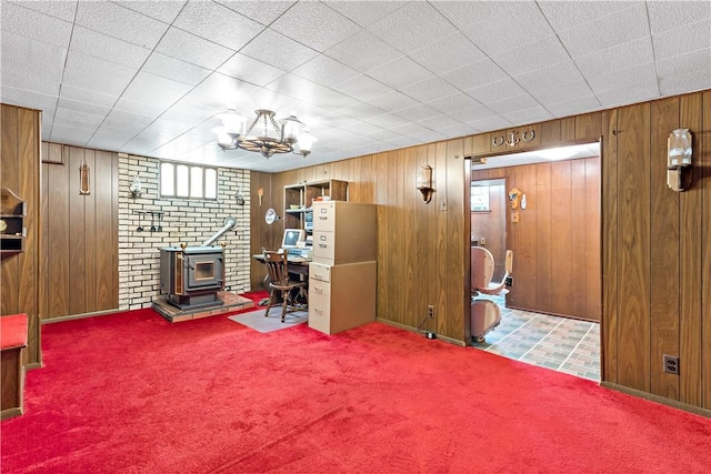 463 Thomas St, Monroeville, PA 15146 - carpeted office space featuring a wood stove, wooden walls, and a chandelier