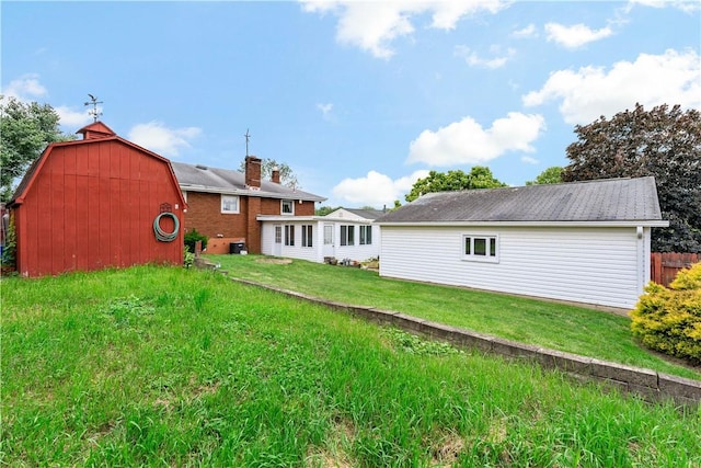 463 Thomas St, Monroeville, PA 15146 - rear view of property with a barn, a lawn, an outbuilding, and a chimney