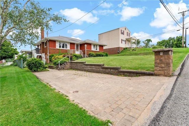 463 Thomas St, Monroeville, PA 15146 - view of front of house featuring a chimney, brick siding, and a front lawn