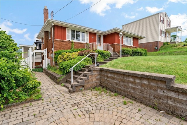 463 Thomas St, Monroeville, PA 15146 - ranch-style home with brick siding, a chimney, a front yard, and stairs