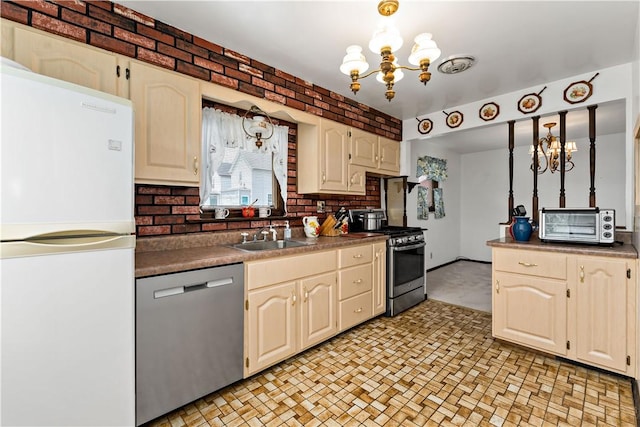 463 Thomas St, Monroeville, PA 15146 - kitchen with stainless steel appliances, a chandelier, and pendant lighting