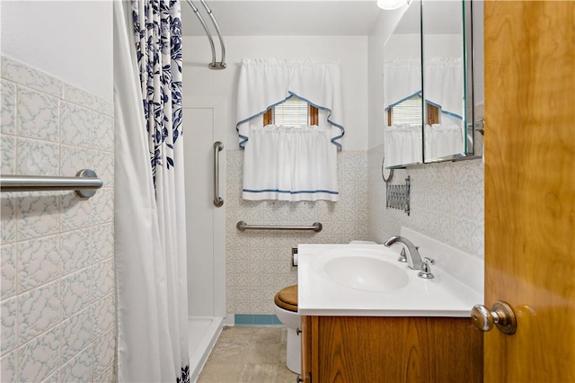 463 Thomas St, Monroeville, PA 15146 - bathroom with tile walls, a shower with shower curtain, vanity, and tile patterned floors