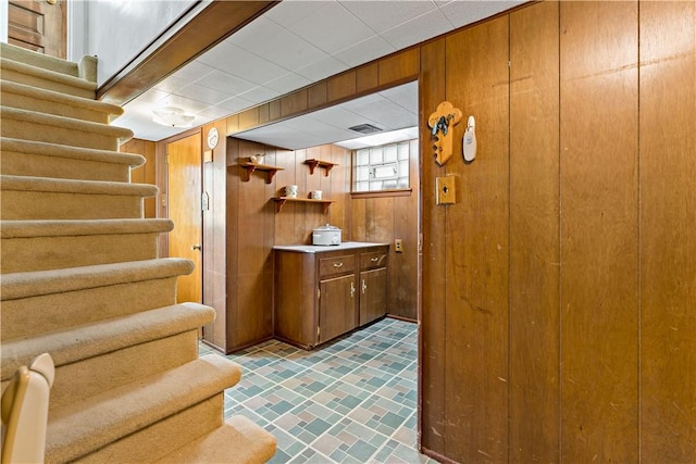 463 Thomas St, Monroeville, PA 15146 - bar featuring wooden walls, stairway, and brick patterned floors