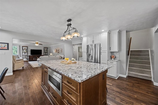 204 Pine Cone Ct, Pine Twp Nal, PA 15090 - kitchen with stainless steel appliances, dark wood-type flooring, white cabinetry, light stone countertops, and recessed lighting