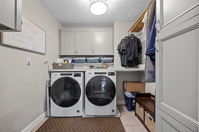 204 Pine Cone Ct, Pine Twp Nal, PA 15090 - laundry area featuring washing machine and dryer, cabinet space, and light tile patterned floors