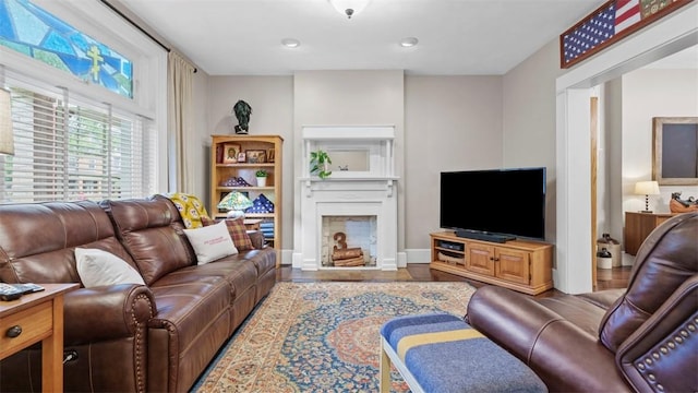 422 S Lang Ave, Point Breeze, PA 15208 - living room with a fireplace with flush hearth, wood finished floors, and recessed lighting