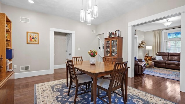 422 S Lang Ave, Point Breeze, PA 15208 - dining space featuring wood finished floors, stairs, and a chandelier