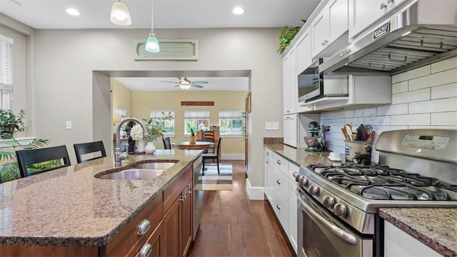 422 S Lang Ave, Point Breeze, PA 15208 - kitchen featuring appliances with stainless steel finishes, under cabinet range hood, a ceiling fan, dark wood-style floors, and recessed lighting