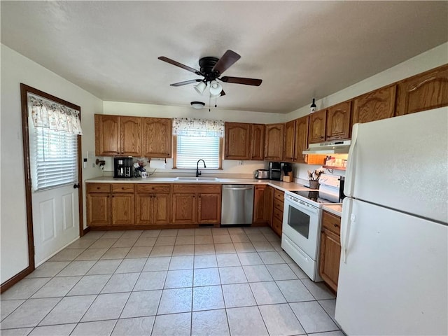 326 Aiken Rd, Shenango Twp Law, PA 16101 - kitchen featuring white appliances, under cabinet range hood, brown cabinetry, and light countertops