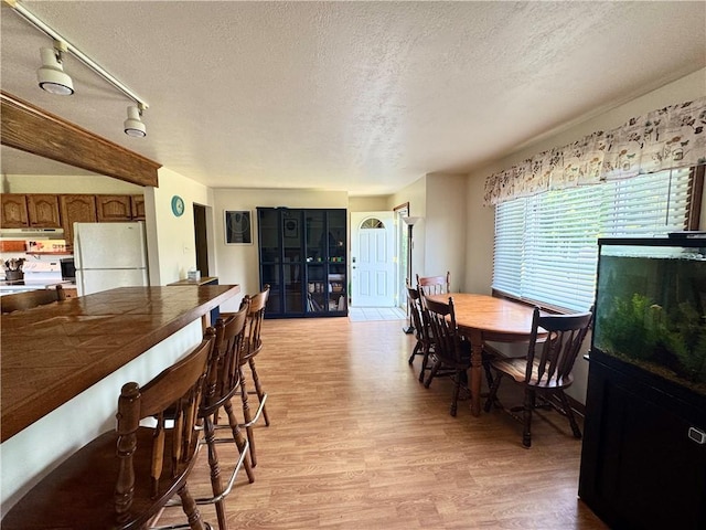 326 Aiken Rd, Shenango Twp Law, PA 16101 - dining area featuring light wood-style flooring and a textured ceiling