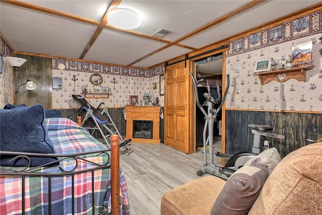 354 Moween Rd, Loyalhanna, PA 15681 - living room with wallpapered walls, a wainscoted wall, and light wood-style flooring