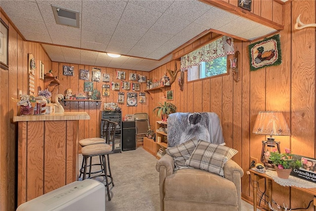 354 Moween Rd, Loyalhanna, PA 15681 - sitting room featuring light colored carpet and wood walls