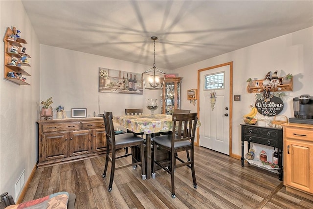 354 Moween Rd, Loyalhanna, PA 15681 - dining space with dark wood finished floors and a chandelier
