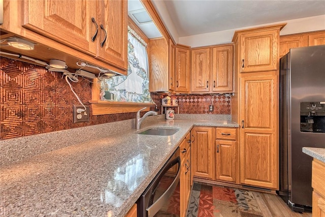 354 Moween Rd, Loyalhanna, PA 15681 - kitchen with stainless steel refrigerator with ice dispenser, dishwasher, light stone countertops, tasteful backsplash, and brown cabinets