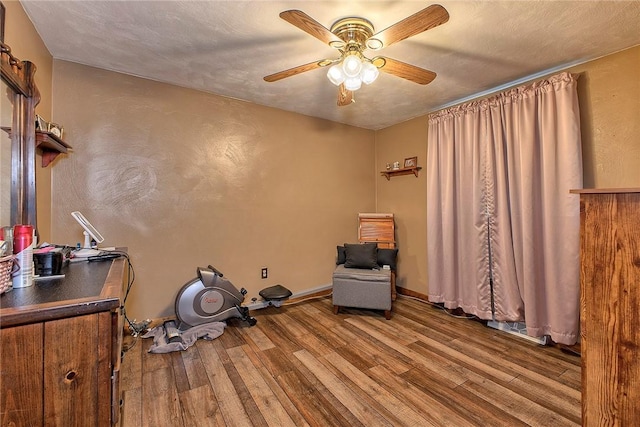 354 Moween Rd, Loyalhanna, PA 15681 - sitting room with wood finished floors, a ceiling fan, and a textured wall