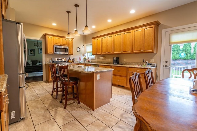 1010 Country Club Rd, Penn Twp Wml, PA 15644 - kitchen with stainless steel appliances, plenty of natural light, light stone counters, and recessed lighting