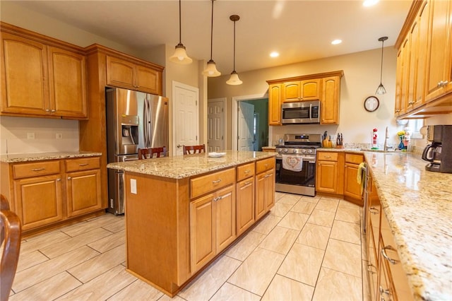 1010 Country Club Rd, Penn Twp Wml, PA 15644 - kitchen featuring appliances with stainless steel finishes, a kitchen island, light stone countertops, decorative light fixtures, and recessed lighting