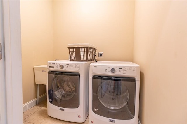 1010 Country Club Rd, Penn Twp Wml, PA 15644 - washroom with washer and dryer and light tile patterned flooring