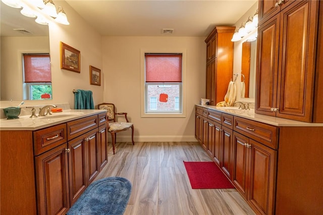 1010 Country Club Rd, Penn Twp Wml, PA 15644 - full bathroom featuring two vanities and wood finished floors
