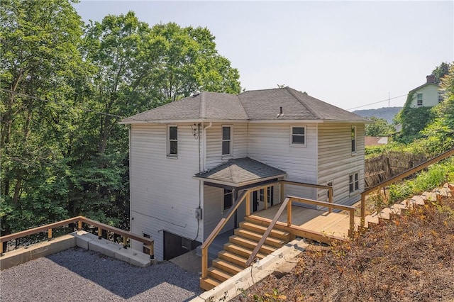 612 Franklin St, Freeport Boro, PA 16229 - back of property with a deck, stairway, and roof with shingles