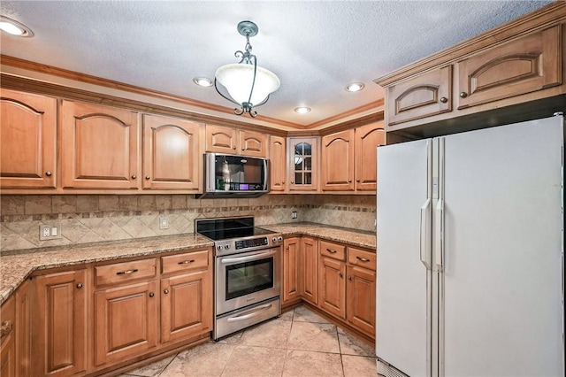 301 Hopper Rd, Delaware Twp, PA 16154 - kitchen featuring freestanding refrigerator, black microwave, stainless steel electric range oven, decorative light fixtures, and light stone counters