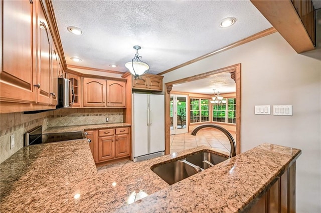 301 Hopper Rd, Delaware Twp, PA 16154 - kitchen featuring white built in refrigerator, electric range oven, ornamental molding, light stone counters, and backsplash
