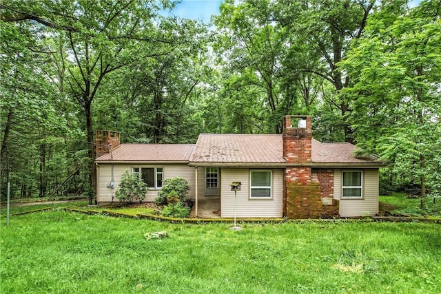 301 Hopper Rd, Delaware Twp, PA 16154 - ranch-style house featuring a chimney and a front lawn