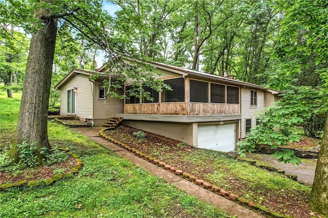 301 Hopper Rd, Delaware Twp, PA 16154 - view of property exterior featuring an attached garage and a sunroom