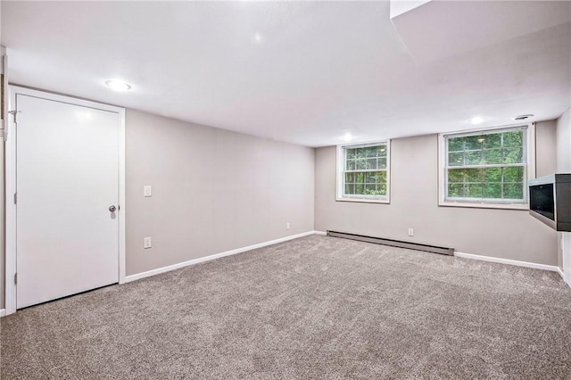 301 Hopper Rd, Delaware Twp, PA 16154 - below grade area featuring a baseboard heating unit and carpet flooring