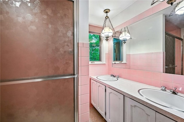 301 Hopper Rd, Delaware Twp, PA 16154 - full bath with tile walls, double vanity, and a stall shower