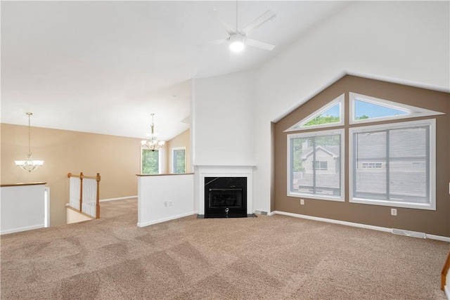 9404 Sundance Dr, South Fayette, PA 15017 - unfurnished living room with a chandelier, lofted ceiling, ceiling fan, carpet flooring, and a high end fireplace