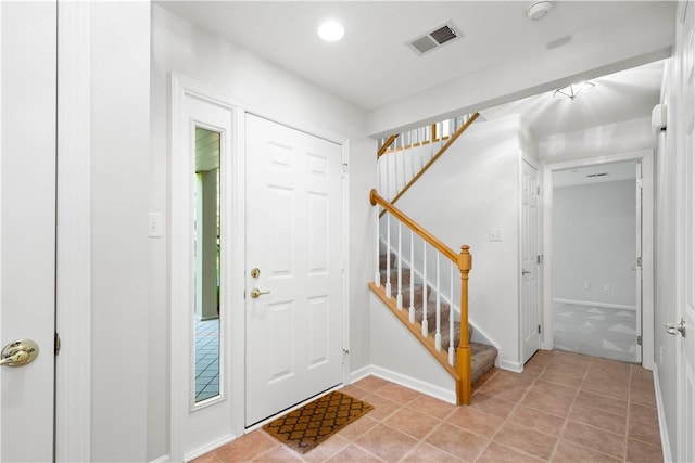 9404 Sundance Dr, South Fayette, PA 15017 - entryway featuring stairs and light tile patterned flooring